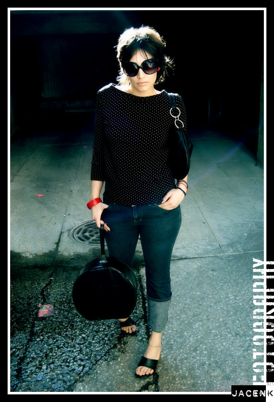 Fashion model poses in alleywar for Vogue Assassin shoot by photographer Jason Kraynek