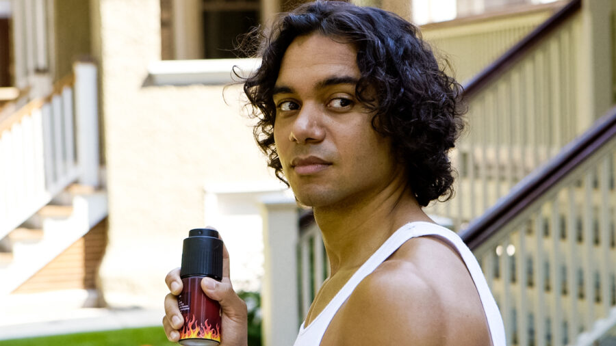 ROCK commercial actor Glenn Stanton holds a deodorant can while looking into camera shot by cinematographer Jason Kraynek