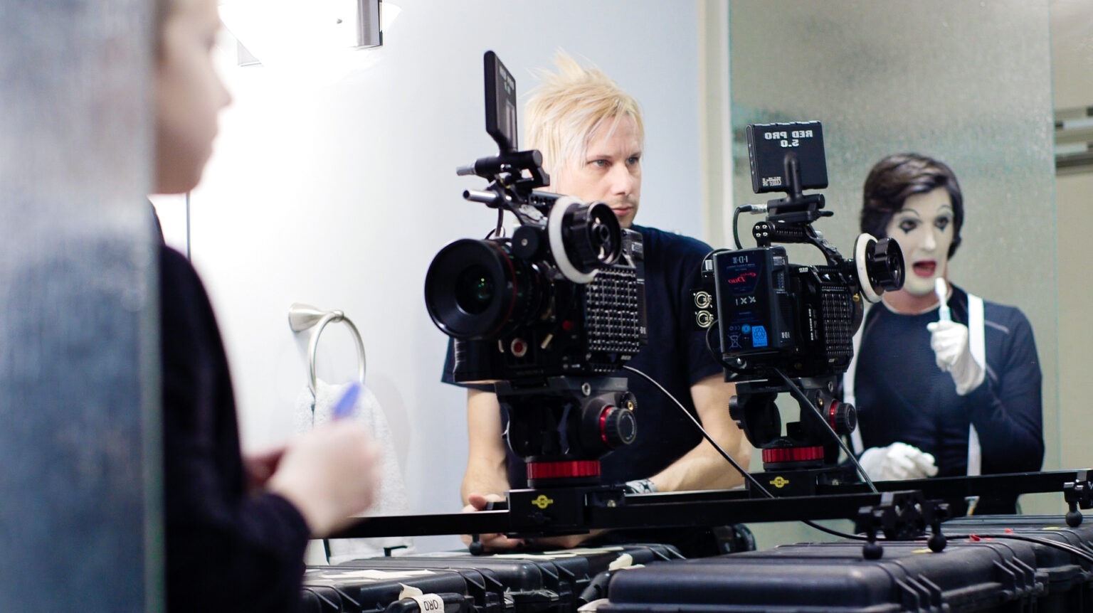 RED Epic camera on a slider with a mime in a bathroom.