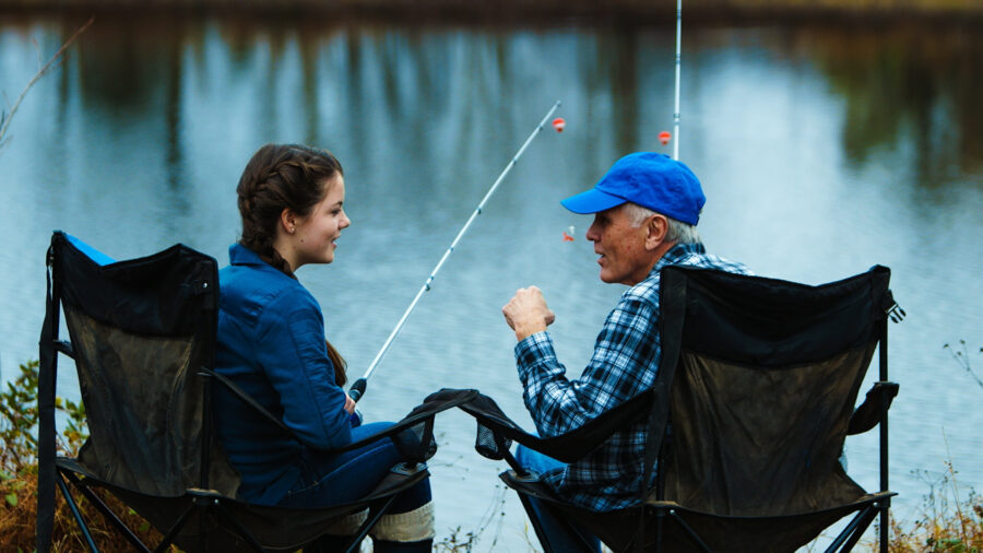 AVMA Life ad campaign actors sit on a lakeside fishing shot by cinematographer Jason Kraynek