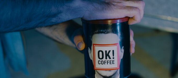 Music Video frame grab, Ganser - Psy Ops, custom coffee prop with face