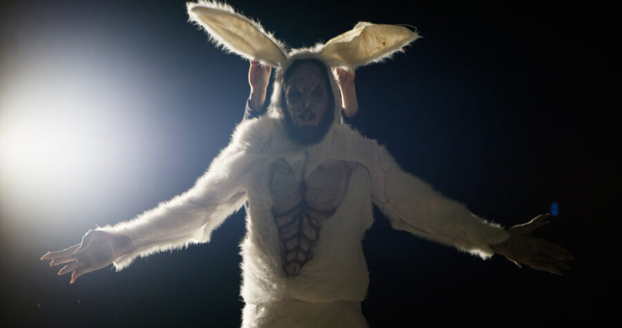 giant horror easter bunny in moody shadowed light