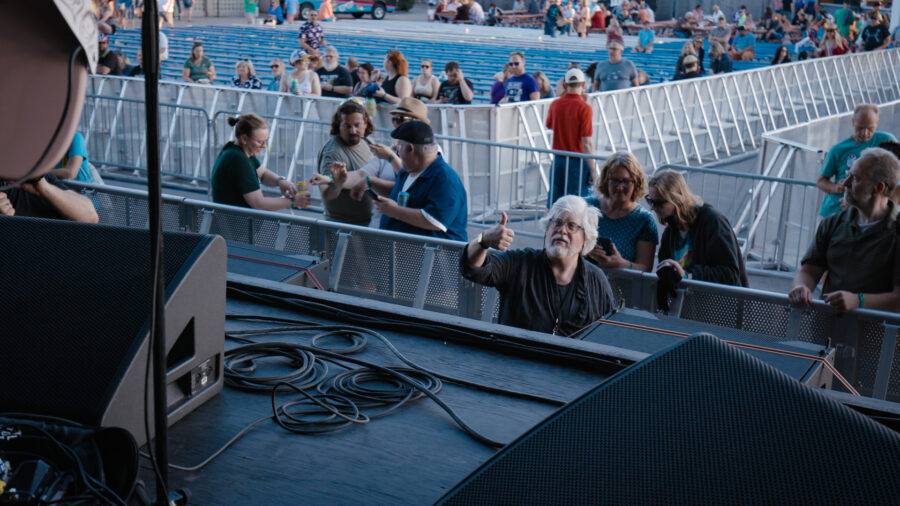 tour roadie onstage from footage shot by Jason Kraynek of the tour vlog and live performance with Brett Newski