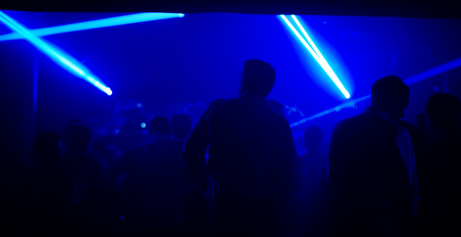chicago nightclub filled with blue haze and people dancing