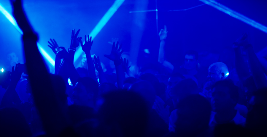 chicago nightclub filled with blue haze and people dancing