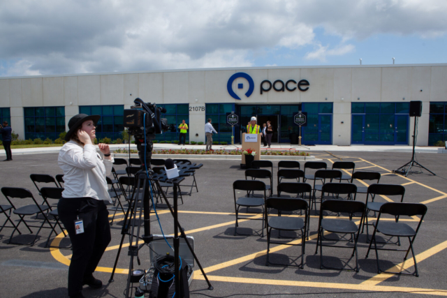 Cameraman during rehearsals at PACE bus building