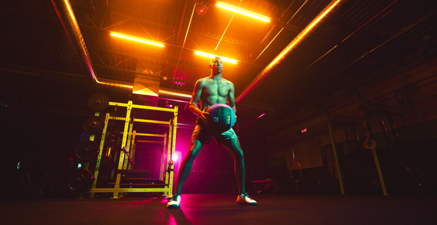 High performance workout routine by instructor in a vividly lit gym by Cinematographer Jason Kraynek.