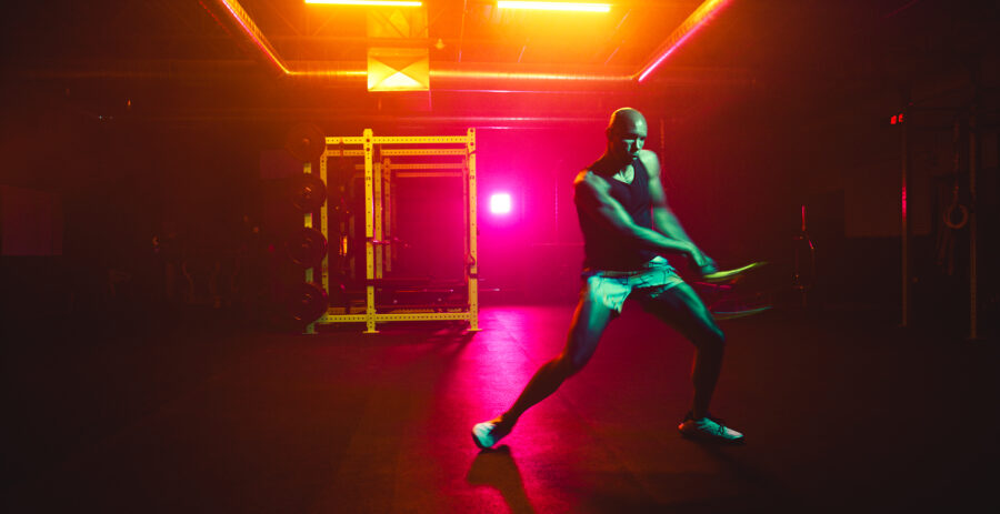 High performance workout routine by instructor in a vividly lit gym by Cinematographer Jason Kraynek.