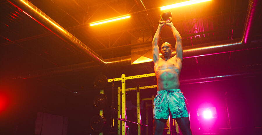 High performance workout routine by instructor in a vividly lit gym by Cinematographer Jason Kraynek.