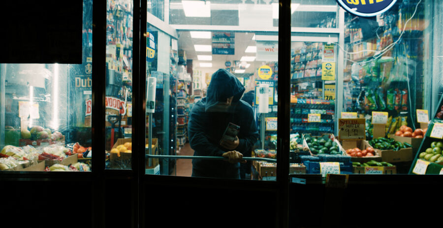 Actor in a advertisment campaign short film for Steel Supplements leaving a store at night in New York